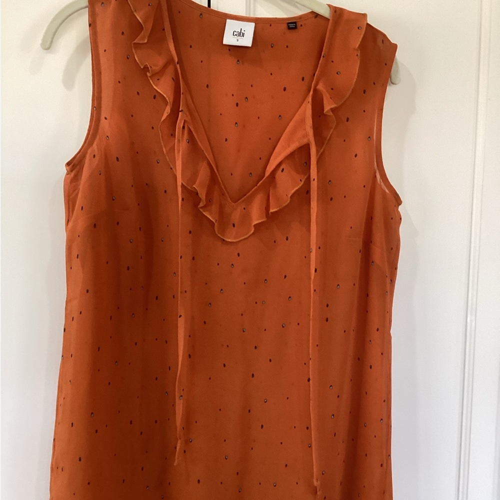 CAbi Rust Orange Sleeveless Ruffle V-Neck Blouse with Tiny Dot Print
